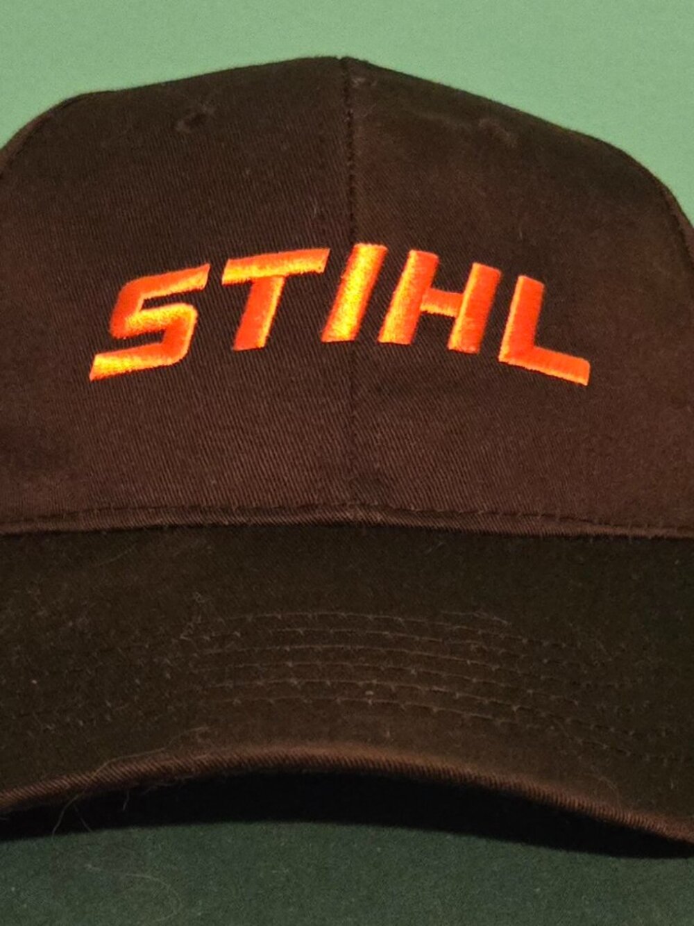 STIHL Black Iconic Cap w/Orange Stihl Stitch Logo Stihl Official Merchandise
